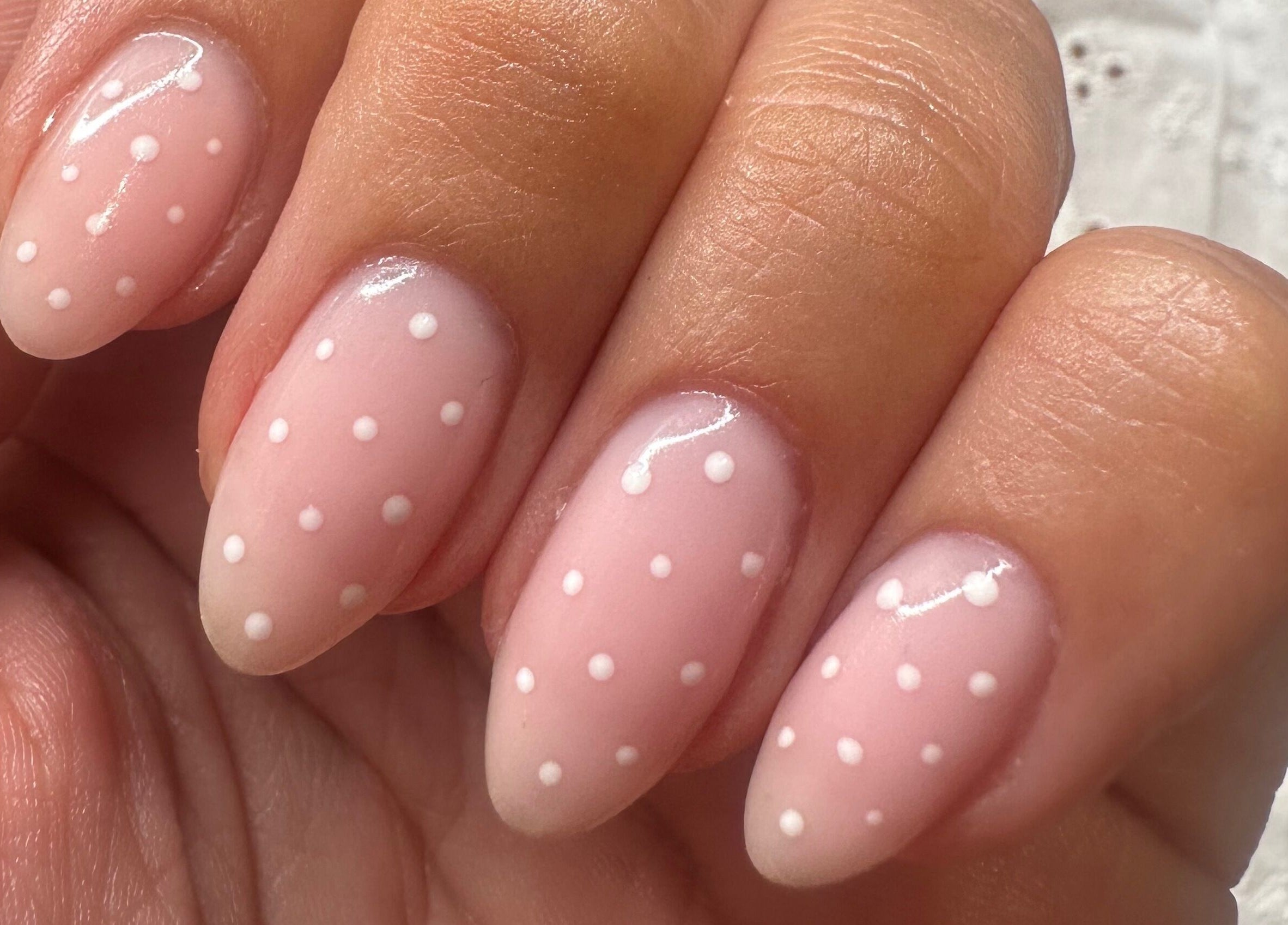 Stunning polka dot nail art design at St Neots Nail Fairy, St Neots, England, GB, showcasing expert manicure.