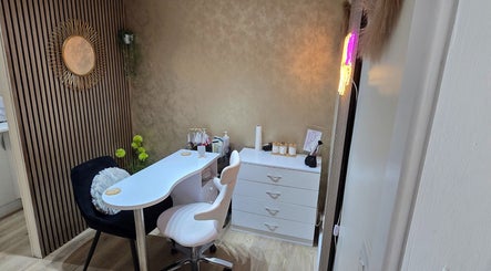 Elegant styling station at L'Essence Hair & Beauty in Derby, England, GB showcasing a chic modern aesthetic.