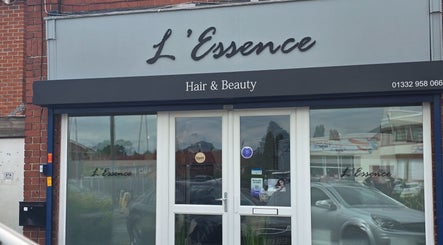 Entrance of L'Essence Hair & Beauty salon in Derby, England, GB, with clear signage and welcoming exterior.