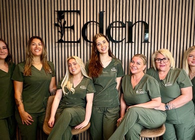 Smiling team at Eden Salon, Tyldesley, England, GB, showcasing professionalism and warmth.