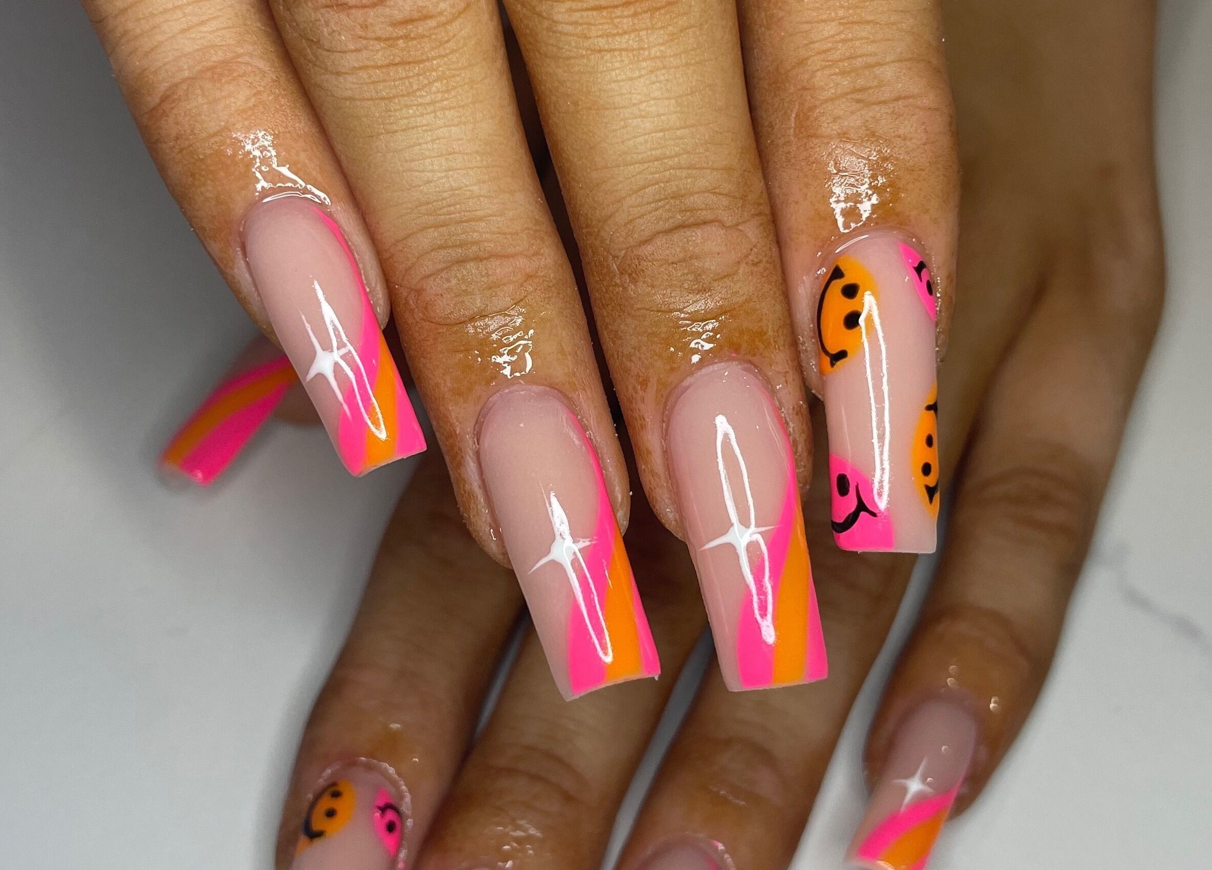 Bright neon nails with smiley designs at Nails By Jem, Yate, England, GB. Stylish and trendy manicure.