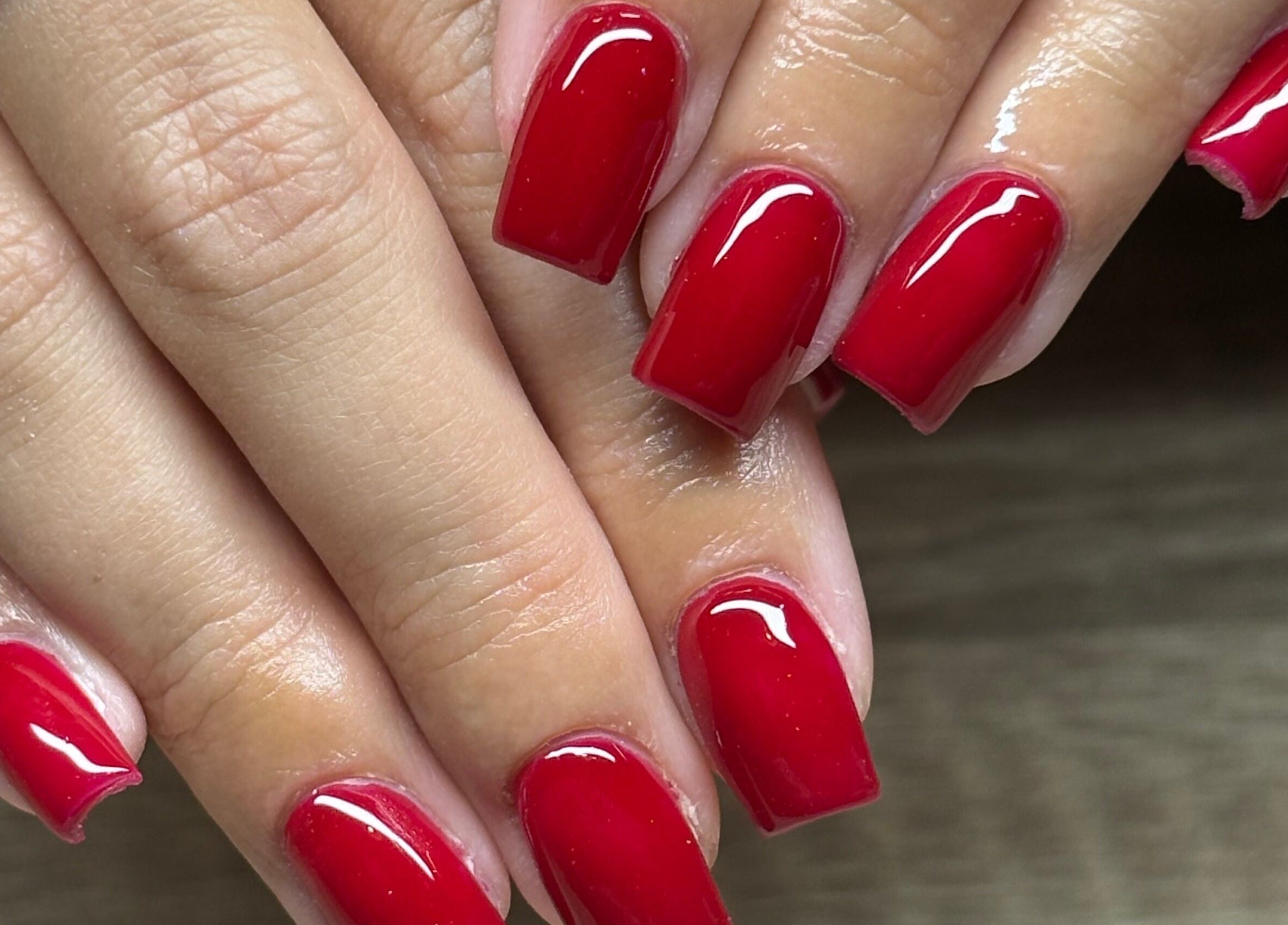 Elegant red manicure at Nails By Jem in Yate, England, GB. Perfect glossy finish.