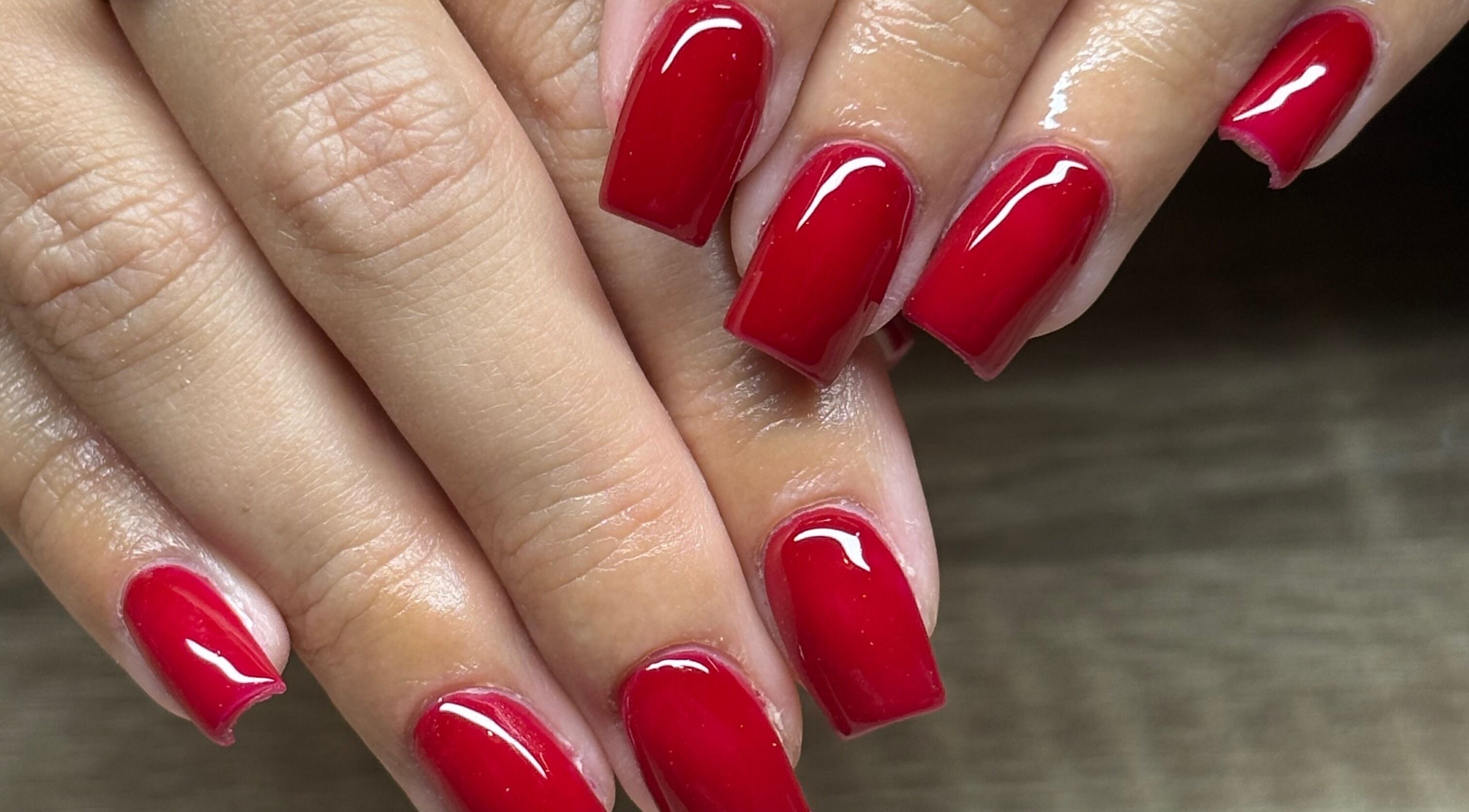 Elegant red manicure at Nails By Jem in Yate, England, GB. Perfect glossy finish.