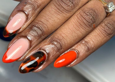 Bold orange and patterned nail art at Nails and Beauty by Sarah, Huddersfield, England, GB.