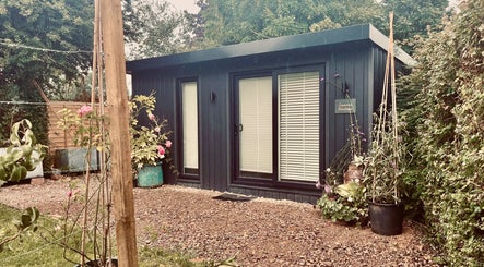 Jasmine’s Beautique in Ebley, England, showcased with charming garden decor and serene beauty.