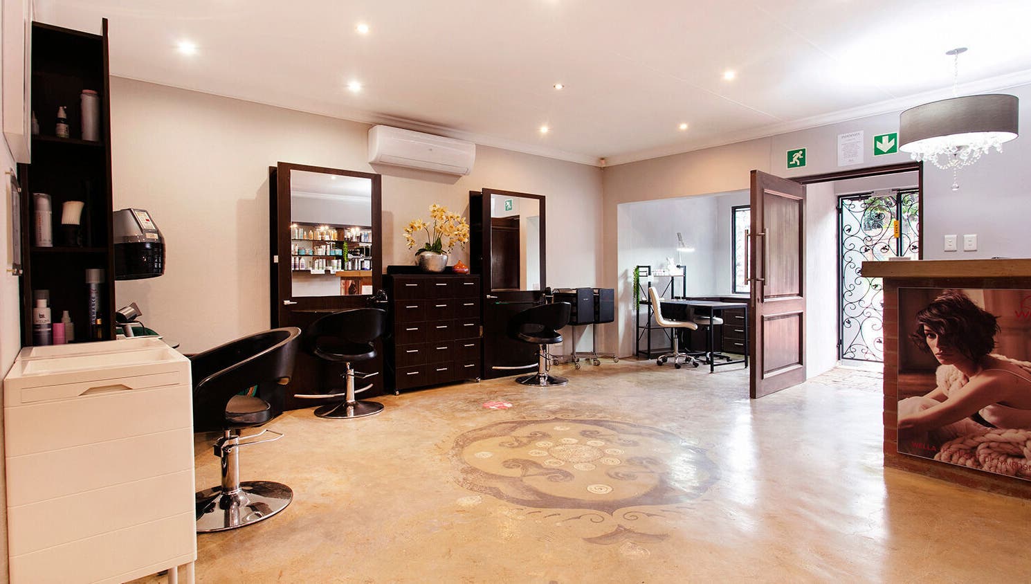 Chic interior at Authentic Collection, Pretoria, Gauteng, ZA featuring modern salon furniture and bright décor.