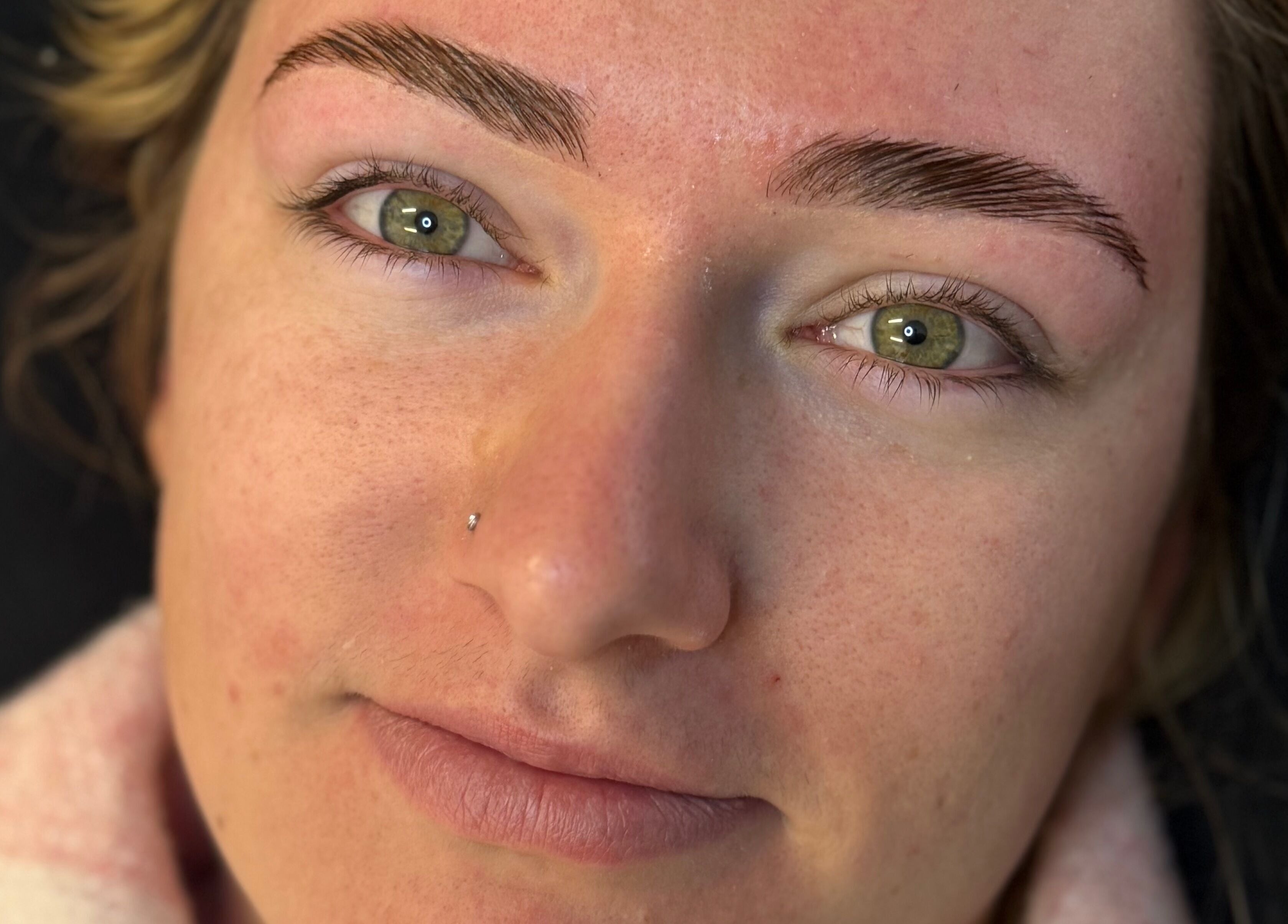 Close-up of a client's well-shaped brows at Killa Arch, Laidley, Queensland, AU.