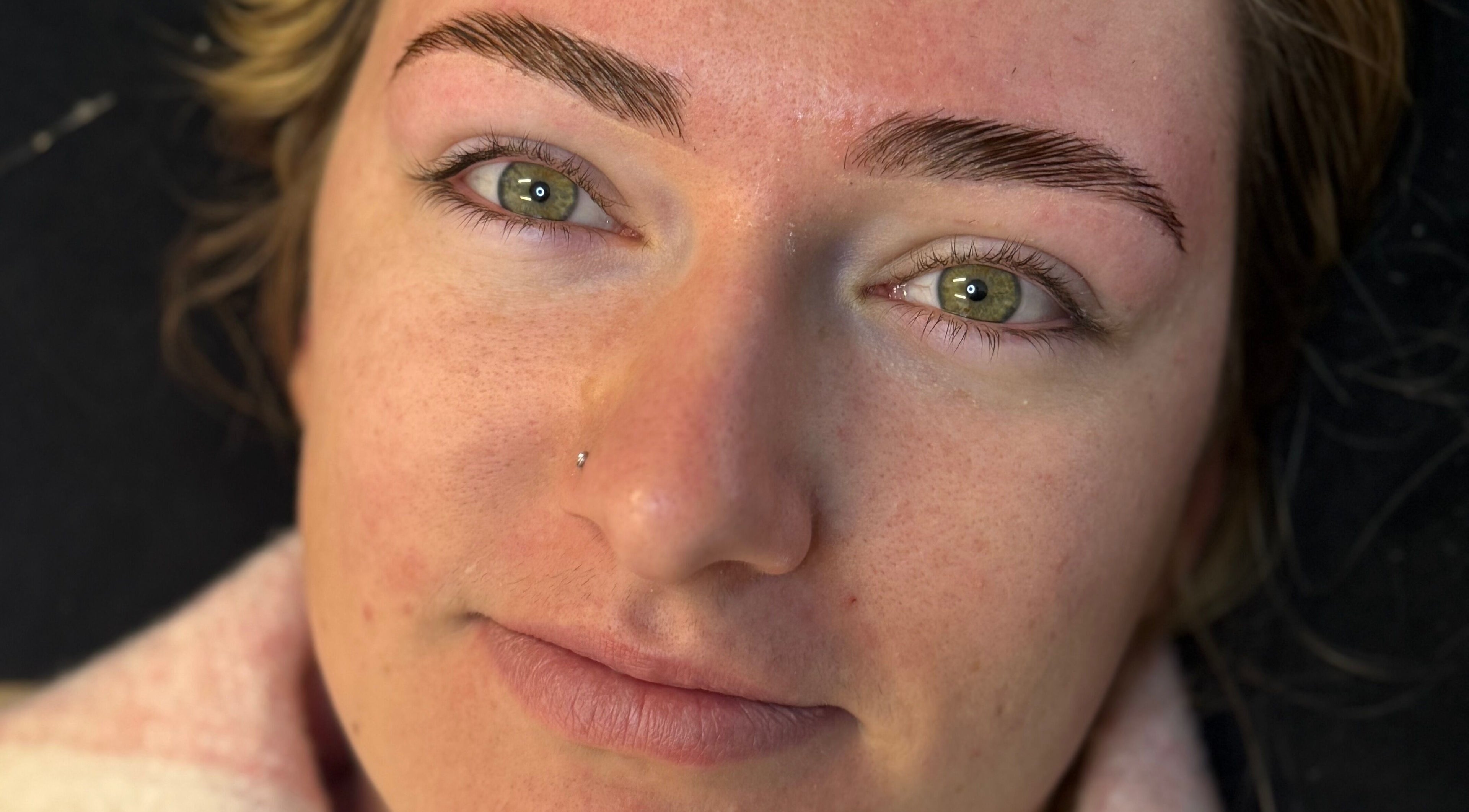 Close-up of a client's well-shaped brows at Killa Arch, Laidley, Queensland, AU.