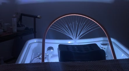 Tranquil spa setting at Off White Salon & Spa, Abu Dhabi, AE, featuring a modern soaking tub.