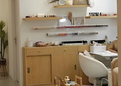 Nail care station at Off White Salon & Spa, Abu Dhabi, AE, featuring elegant displays of nail polishes.