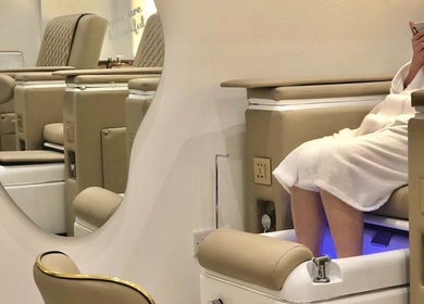 Relaxing pedicure at Off White Salon & Spa, Abu Dhabi, AE, featuring plush seating and soothing ambiance.