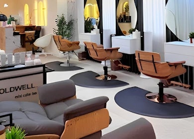 Elegant styling chairs and mirrors at Off White Salon & Spa, Abu Dhabi, AE, showcasing luxury and comfort.