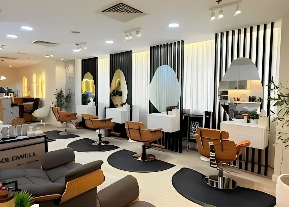 Chic interior of Off White Salon & Spa, Abu Dhabi, AE with stylish chairs and mirrors.