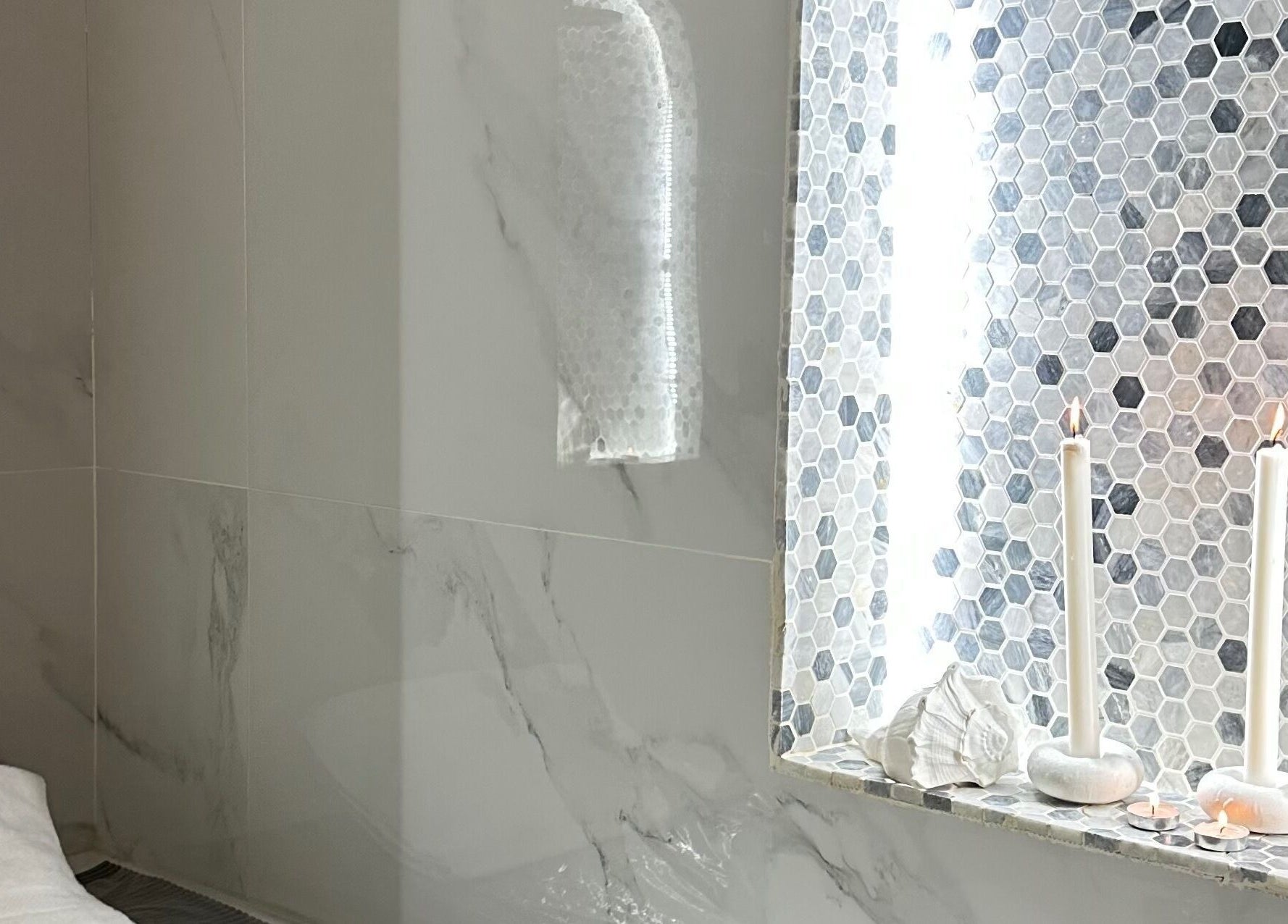 Relaxing spa corner with candles at Off White Salon & Spa, Abu Dhabi, AE, showcasing elegance and tranquility.