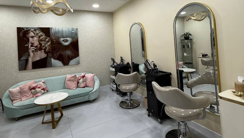 Modern interior of Moora Beauty Salon in Dubai, Dubai, AE featuring stylish seating and elegant mirrors.