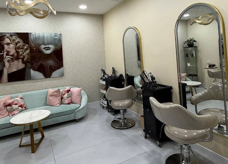 Modern interior of Moora Beauty Salon in Dubai, Dubai, AE featuring stylish seating and elegant mirrors.