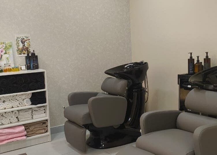 Stylish salon chairs and shelves at Moora Beauty Salon in Dubai, Dubai, AE, offering a relaxing experience.