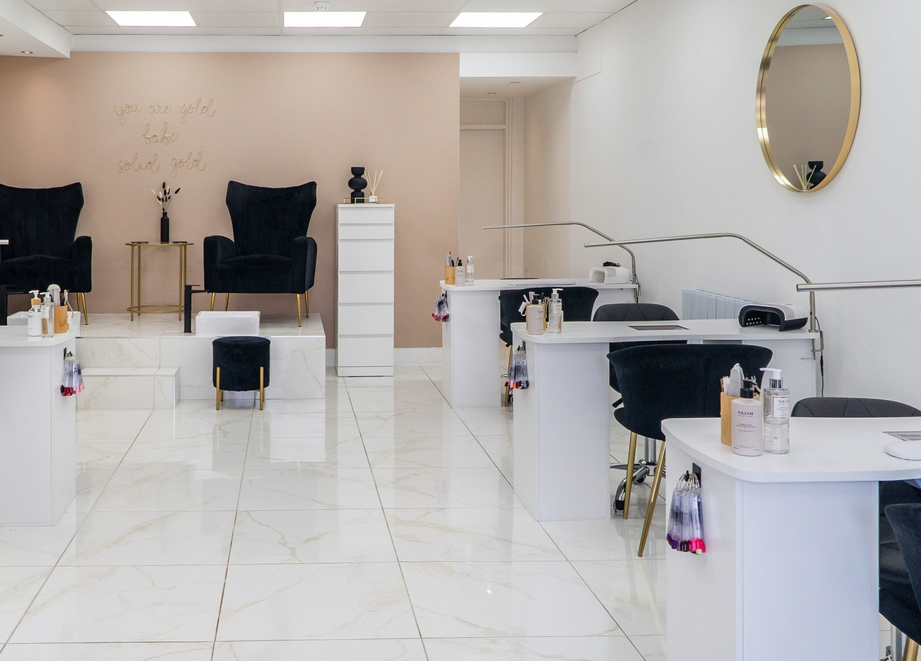 Modern, chic nail salon interior at Josie & Co, Lytham St Annes, England, GB, featuring plush seating and polished decor.