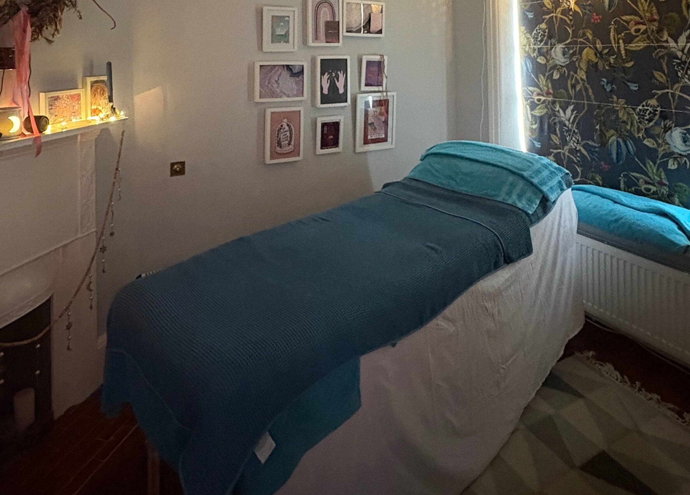 Cozy treatment room at EOS Wellness Treatments, Harrogate, England, GB with calming decor and soft lighting.