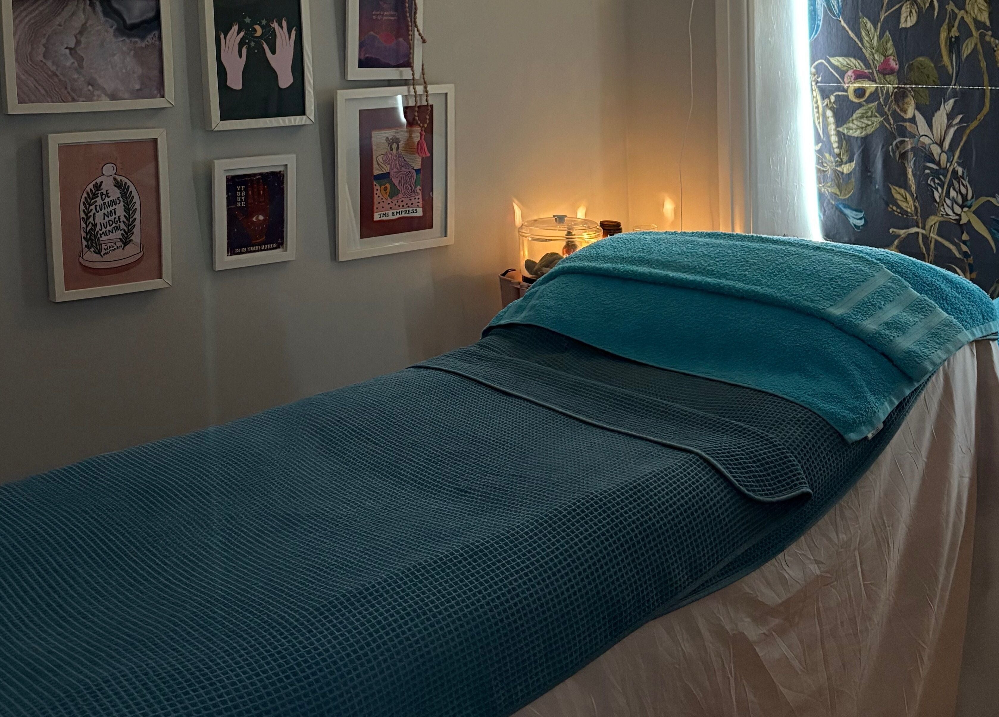 Relaxing therapy room at EOS Wellness Treatments, Harrogate, England, GB, featuring a comfortable massage bed.