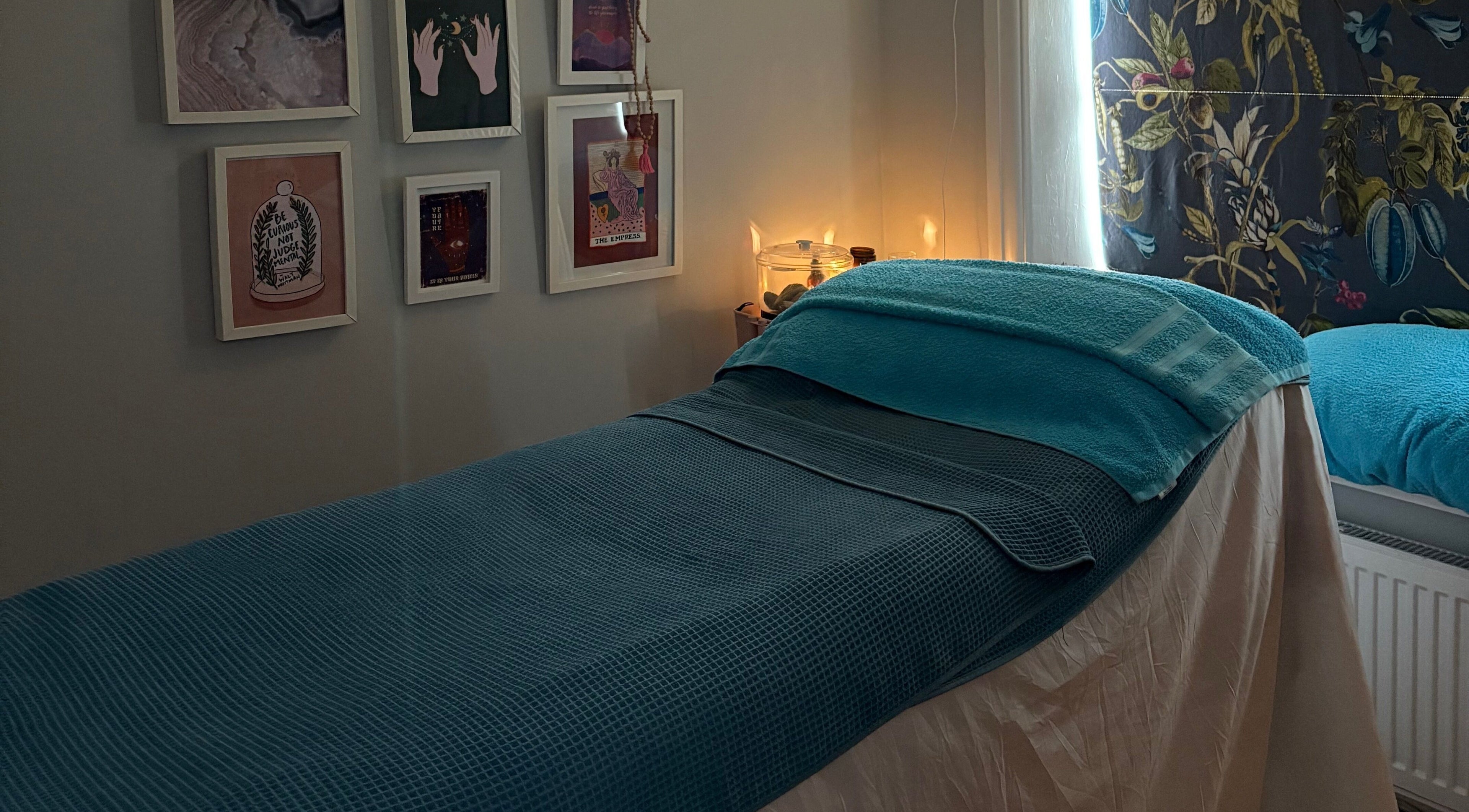 Relaxing therapy room at EOS Wellness Treatments, Harrogate, England, GB, featuring a comfortable massage bed.