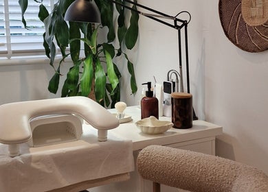 Cozy manicure station at Klae Beauty, Camberley, England, GB featuring modern decor and lush greenery.