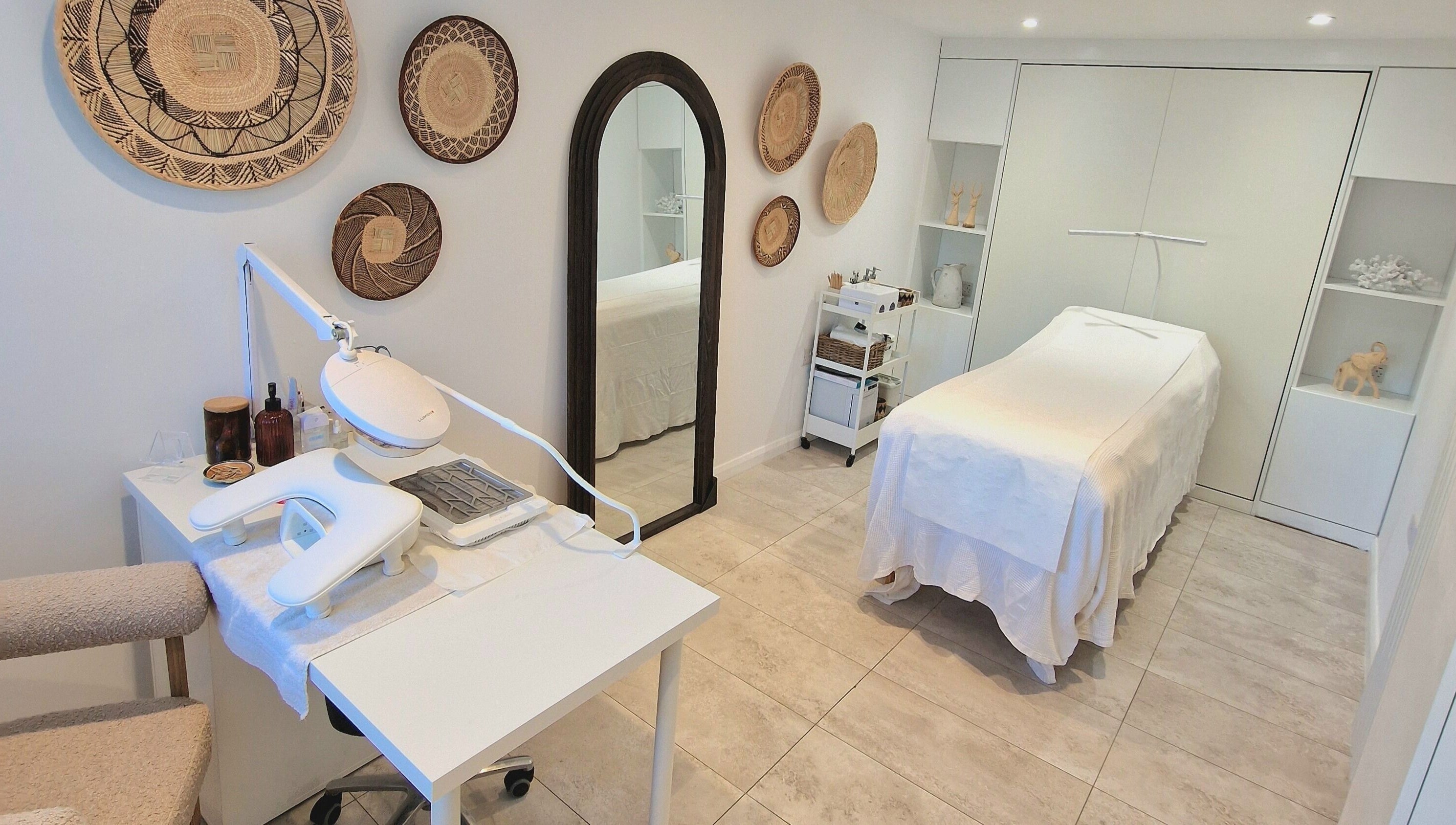 Tranquil treatment room at Klae Beauty, Camberley, England, GB, with a massage table and modern decor.