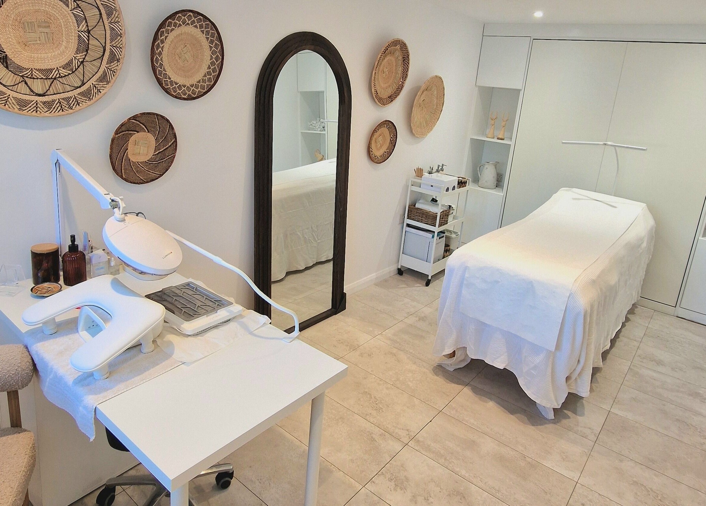 Tranquil treatment room at Klae Beauty, Camberley, England, GB, with a massage table and modern decor.
