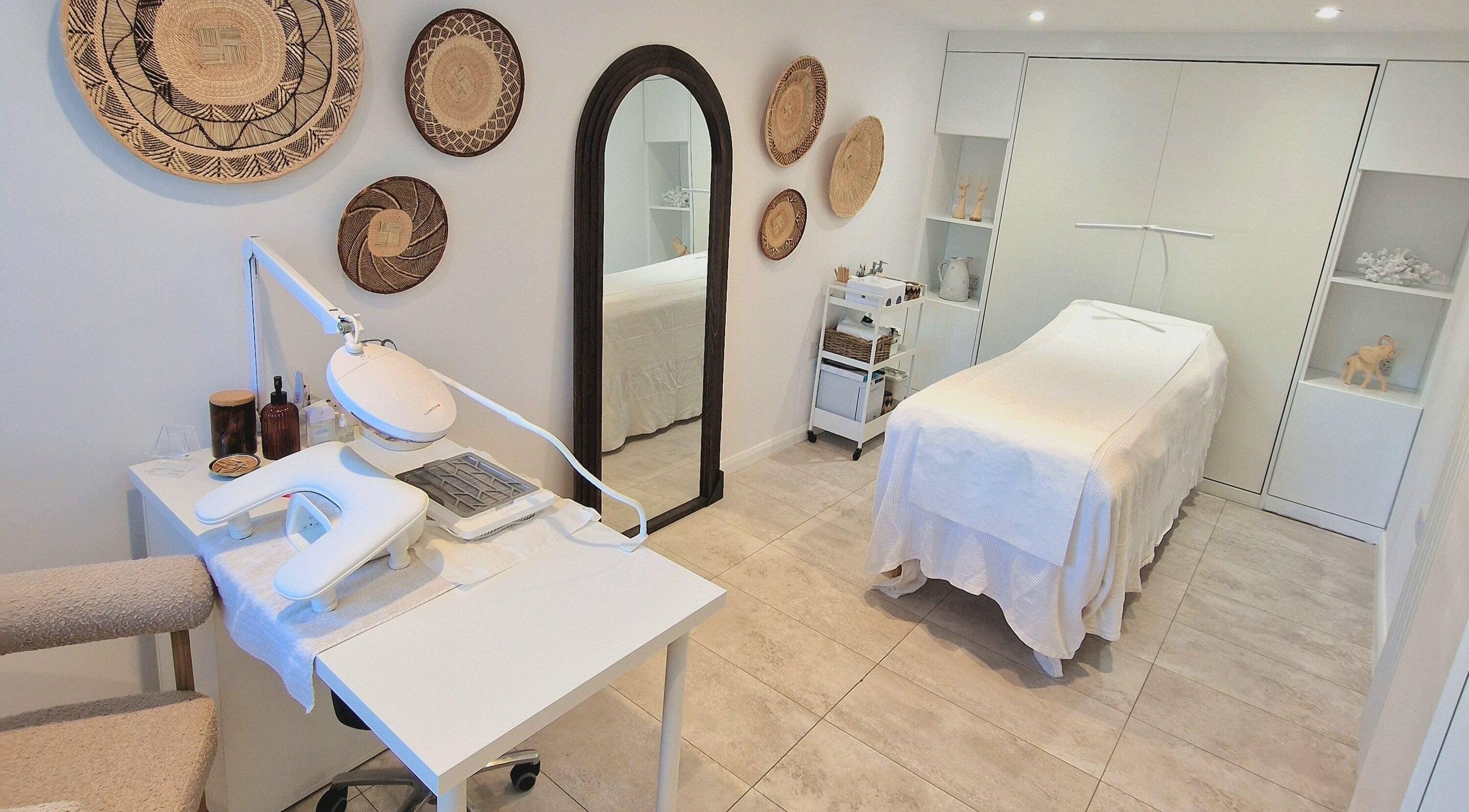 Tranquil treatment room at Klae Beauty, Camberley, England, GB, with a massage table and modern decor.
