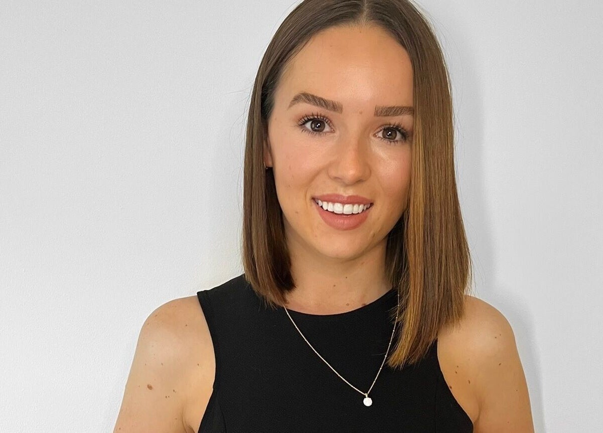 Woman with a radiant smile at Klae Beauty, Camberley, England, GB.