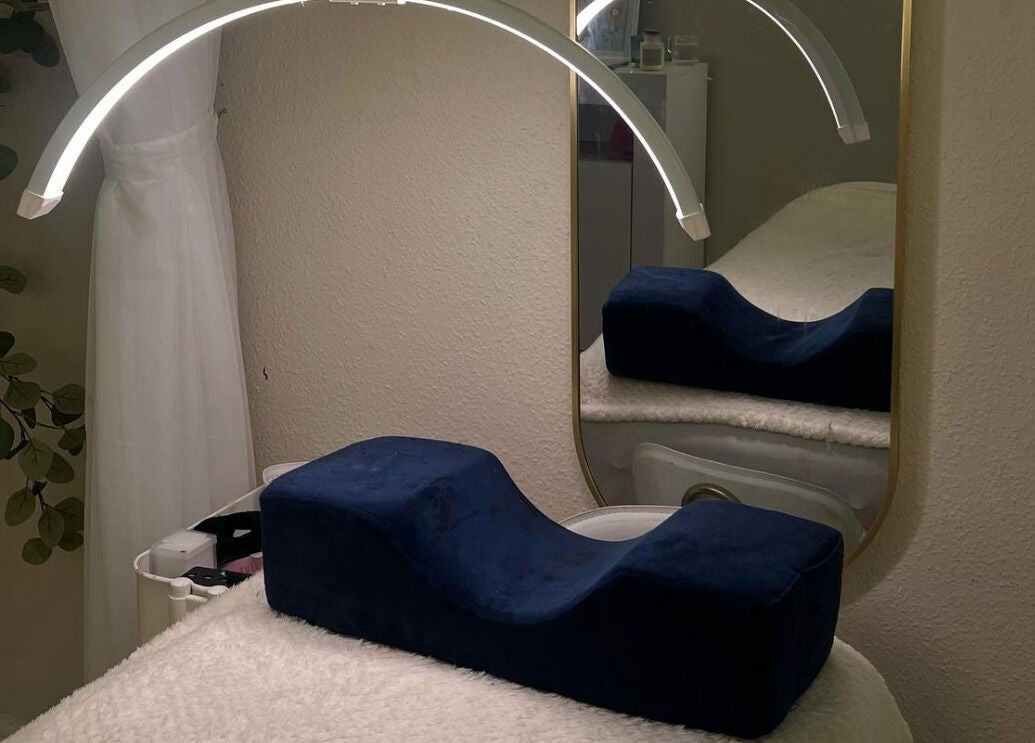Elegant beauty space at Marose Aesthetics, Bradford, England, GB, featuring a stylish mirror and comfy treatment bed.