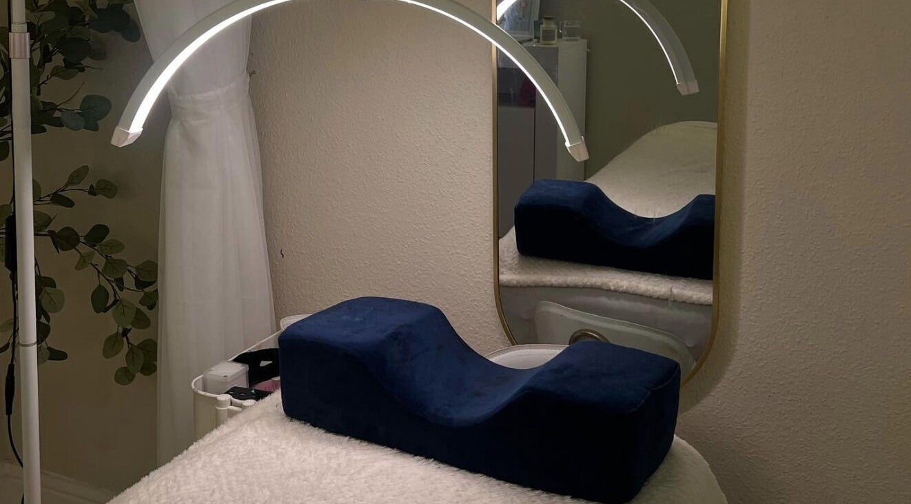 Elegant beauty space at Marose Aesthetics, Bradford, England, GB, featuring a stylish mirror and comfy treatment bed.