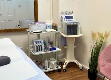 Treatment room at Shape Zone London, London, England, GB, showcasing modern equipment and cozy setting.