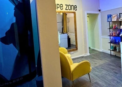 Welcoming interior of Shape Zone London with product display and cozy seating, London, England, GB.