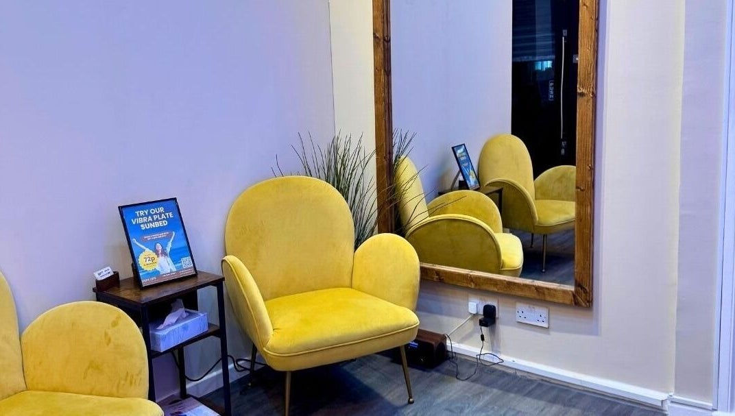 Elegant yellow chairs and mirror at Shape Zone London, London, England, GB offering modern wellness ambiance.