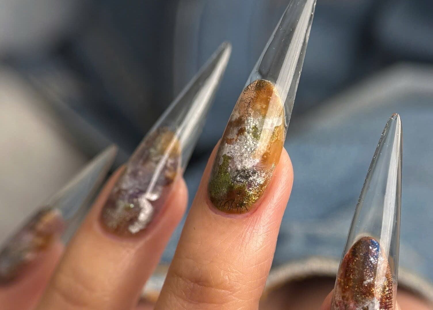 Stunning nail art with earthy tones at Iconic Nails Studio, Los Altos, California, US.
