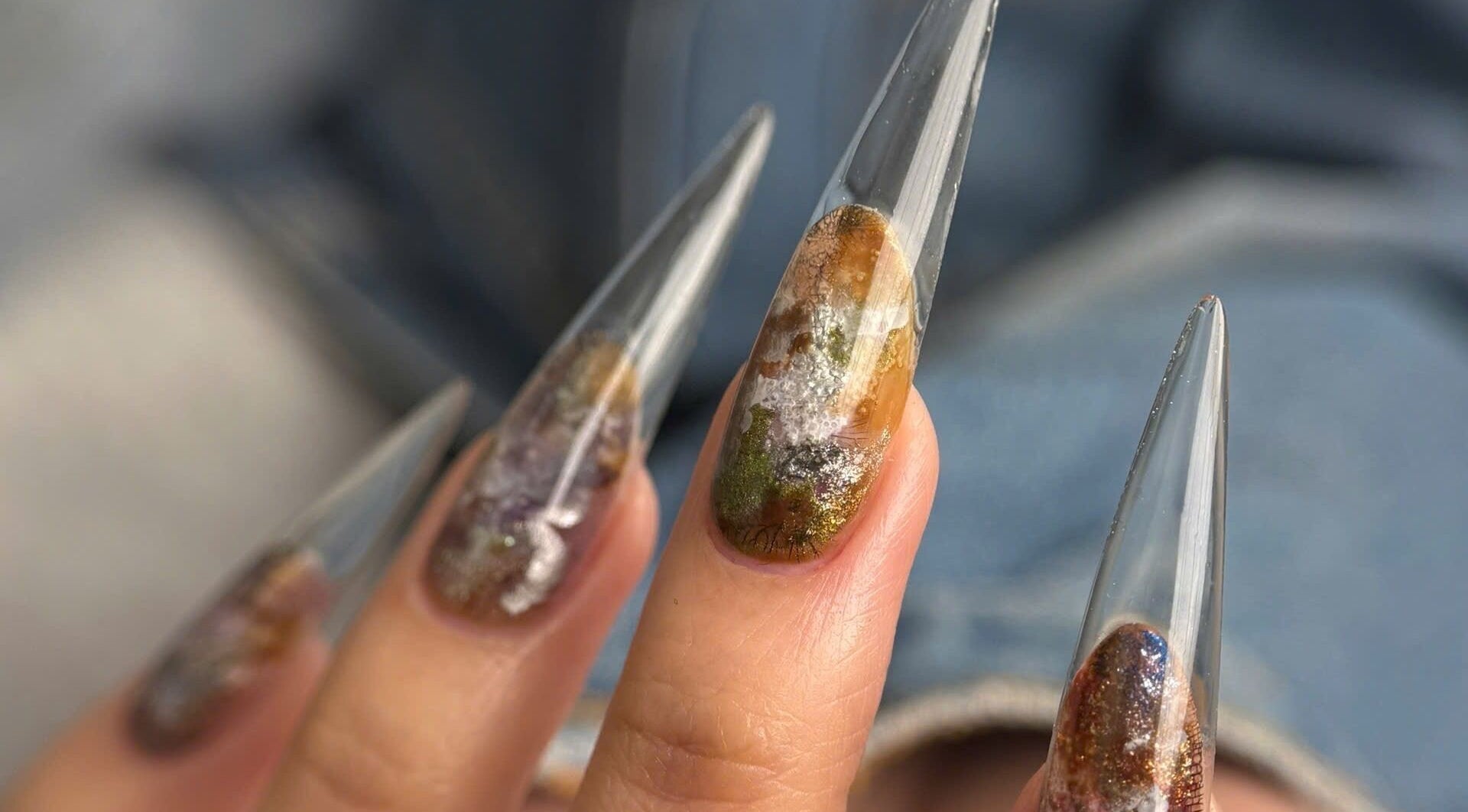 Stunning nail art with earthy tones at Iconic Nails Studio, Los Altos, California, US.