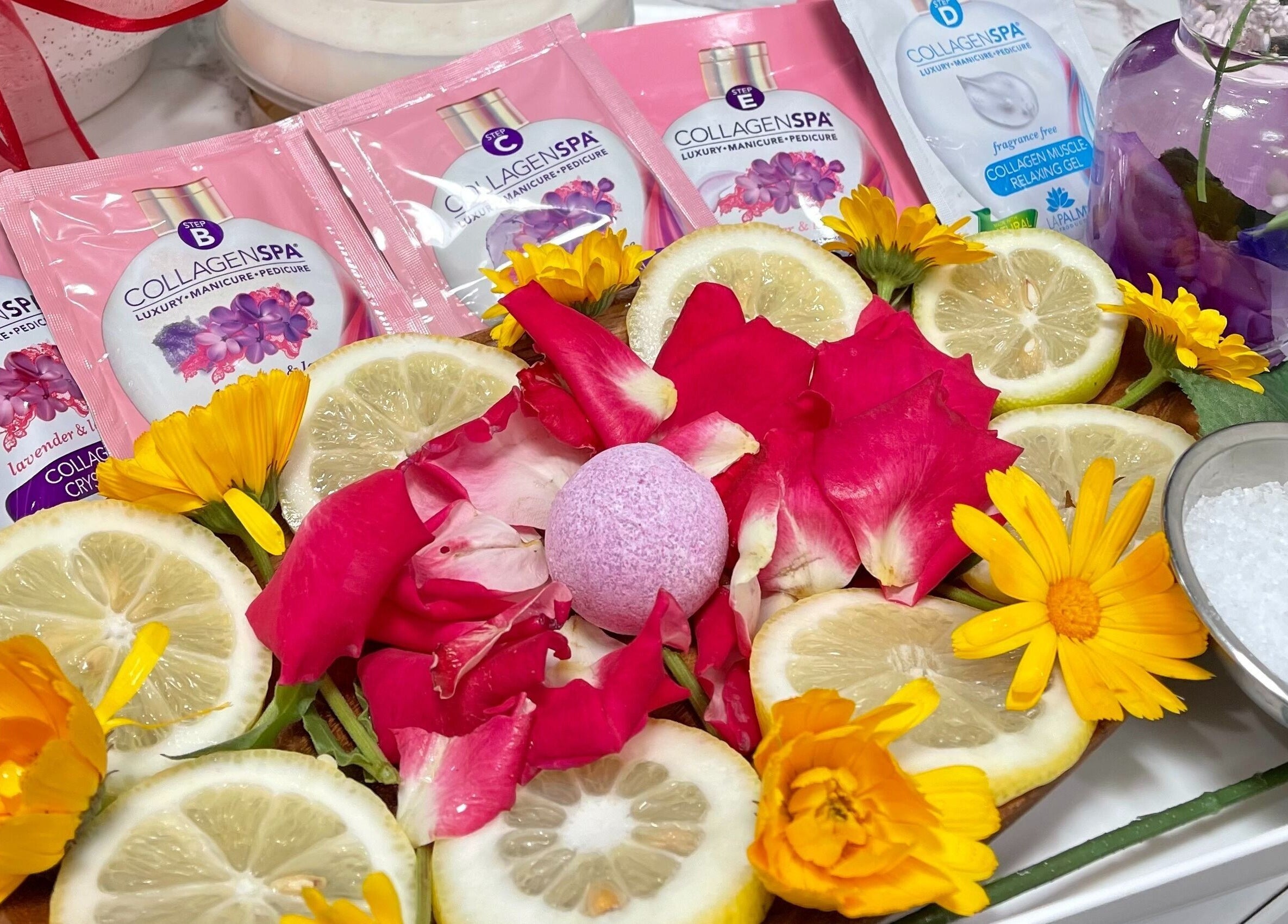 Luxurious spa botanicals at Iconic Nails Studio in Los Altos, California, US, featuring vibrant petals and citrus.