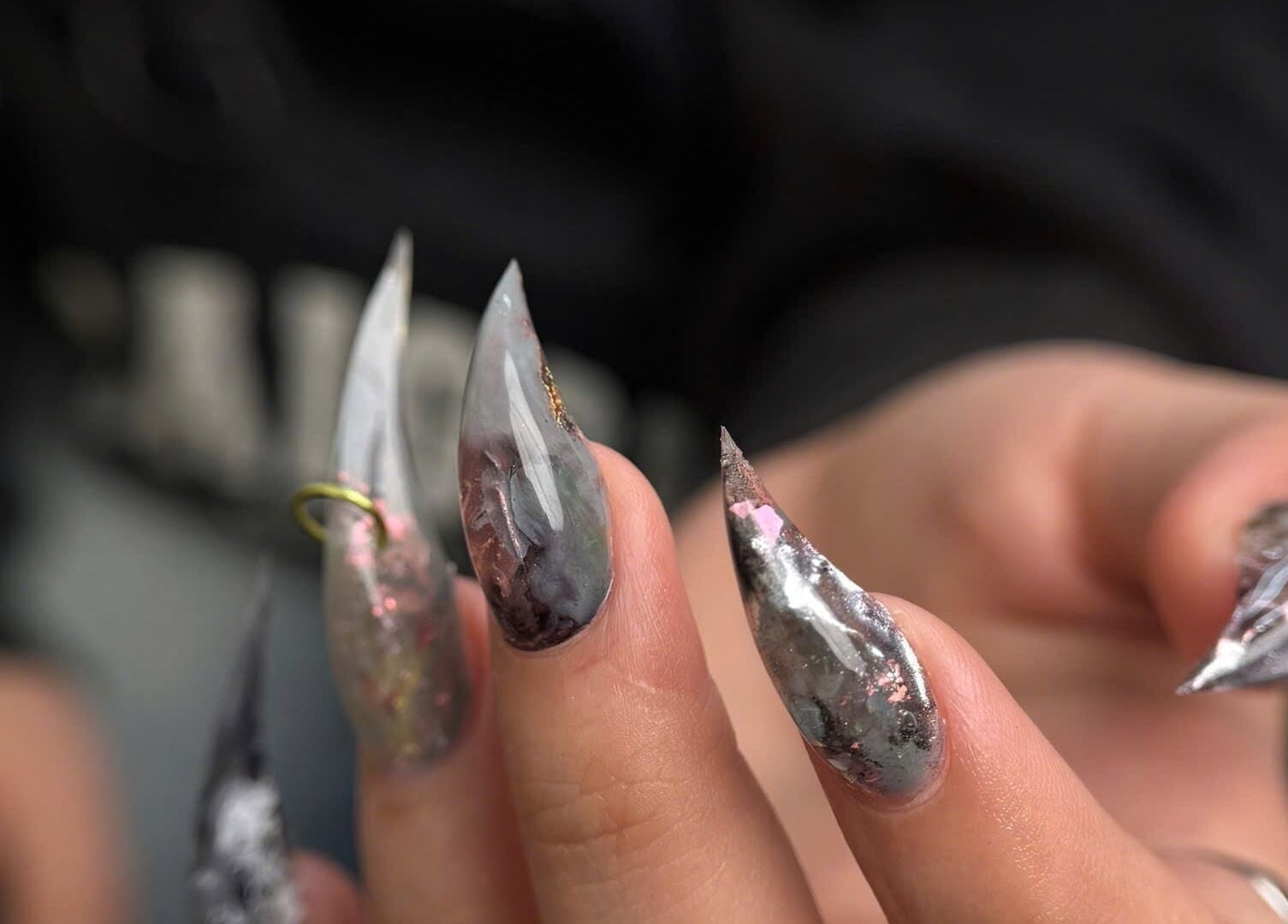 Stylish nail art with metallic finish at Iconic Nails Studio, Los Altos, California, US.