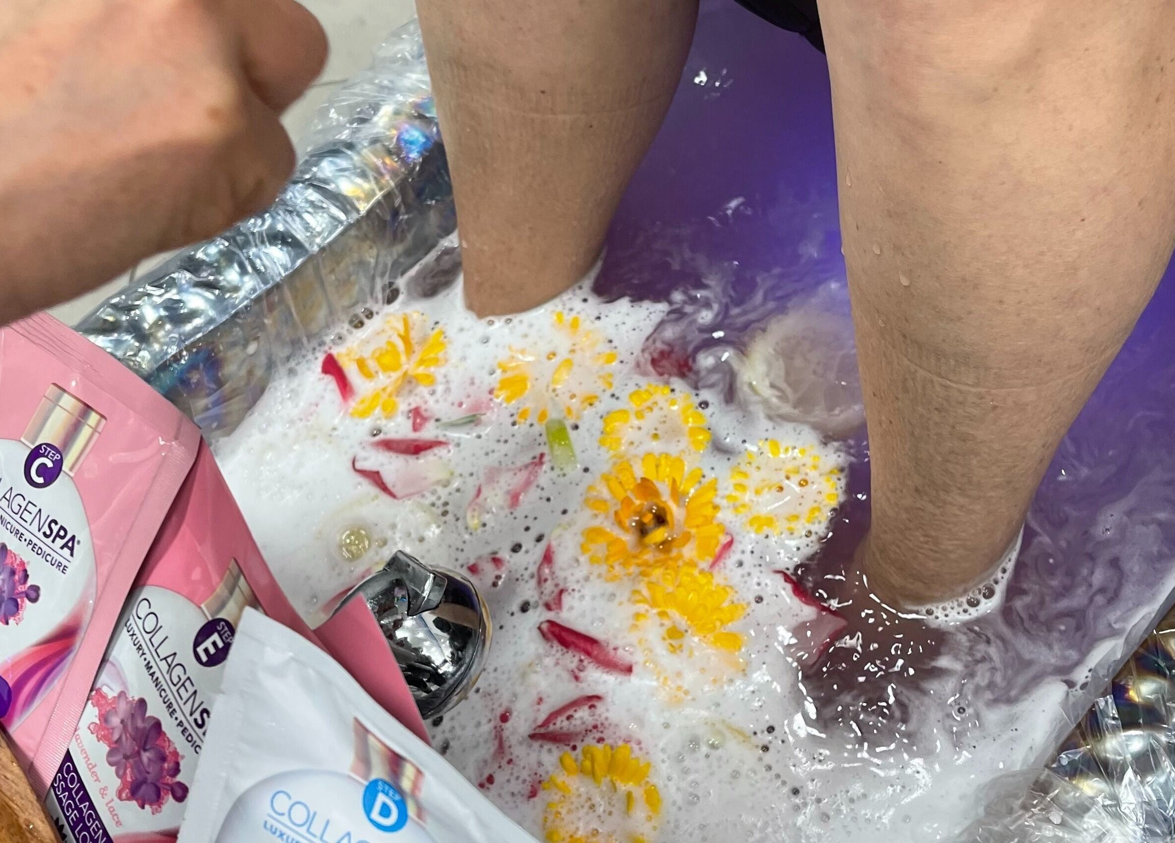 Relaxing pedicure at Iconic Nails Studio, Los Altos, California, US with floral accents and collagen spa treatment.