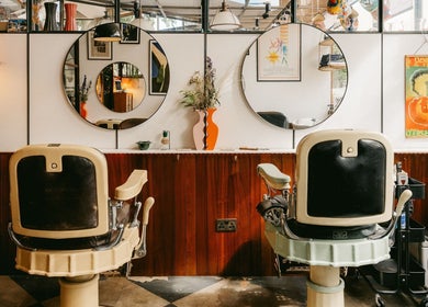 Elegant vintage interior at Lume Hair Studio | Netil Lane, London, England, GB with stylish mirrors and chairs.
