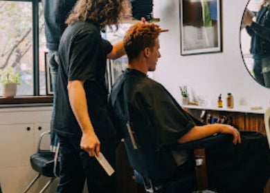 Haircut session at Lume Hair Studio | Netil Lane, London, England, GB, with stylist attending to a client.