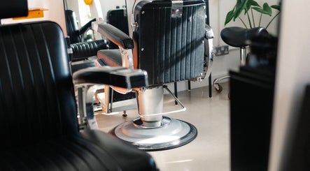 Modern salon chair at Lume Hair Studio | Netil Lane, London, England, GB, offering sleek styling services.