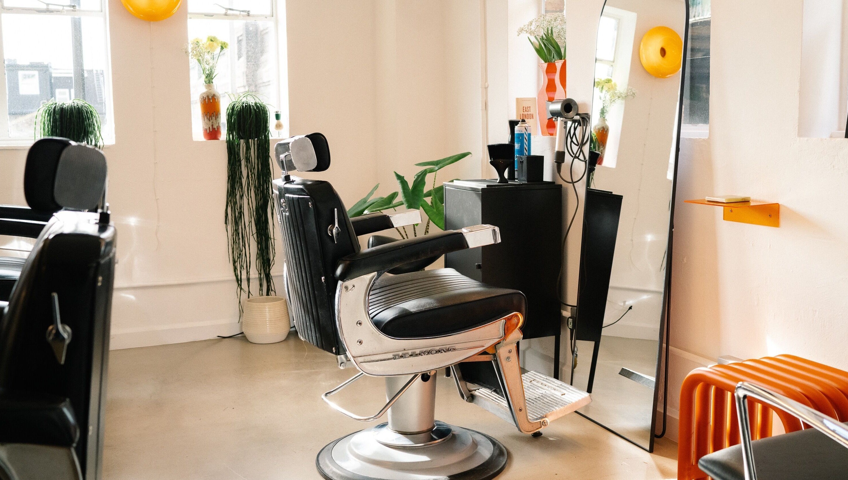 Lume Hair Studio | Netil Lane, London, features modern barber chair with mirror and plants.