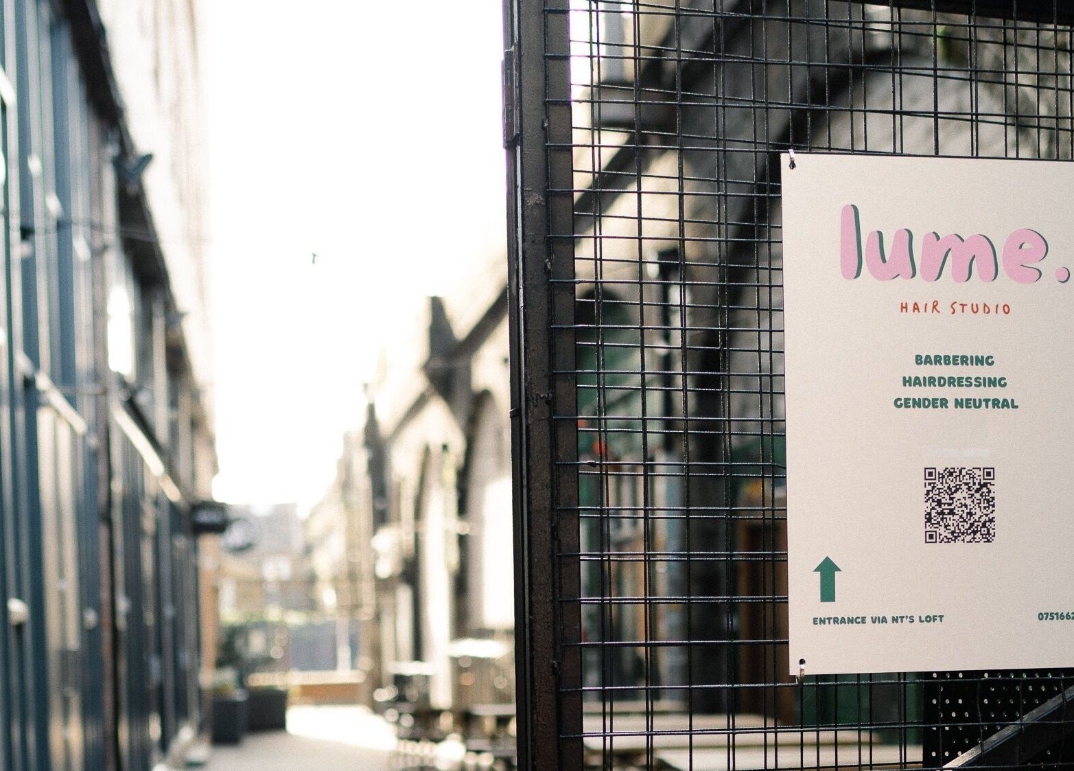Lume Hair Studio entrance sign at Netil Lane, London, England, GB, showcasing hairdressing services.