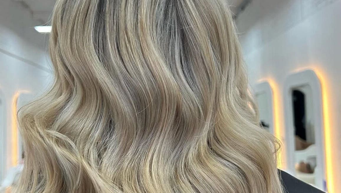 Stunning blonde waves styled at BIMBOS, Palm Beach, Queensland, AU. Perfect hair in a chic salon.