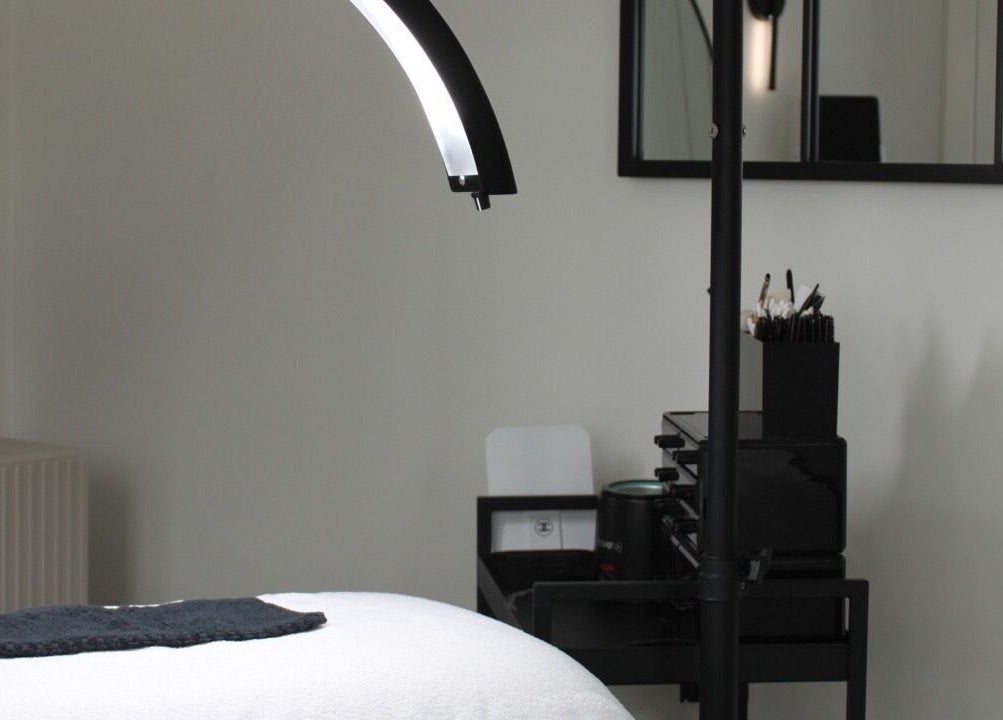 Cozy treatment room at Just Do Fab, Brighton And Hove, England, GB, featuring a massage bed and lighting.