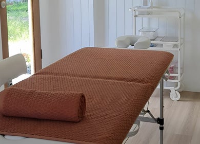 Relaxing massage room at Cup & Cleanse, Runaway Bay, Queensland, AU with a cozy treatment bed.