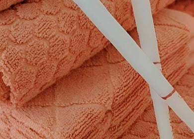 Soft peach towels at Cup & Cleanse, Runaway Bay, Queensland, AU, offer a comforting spa experience.