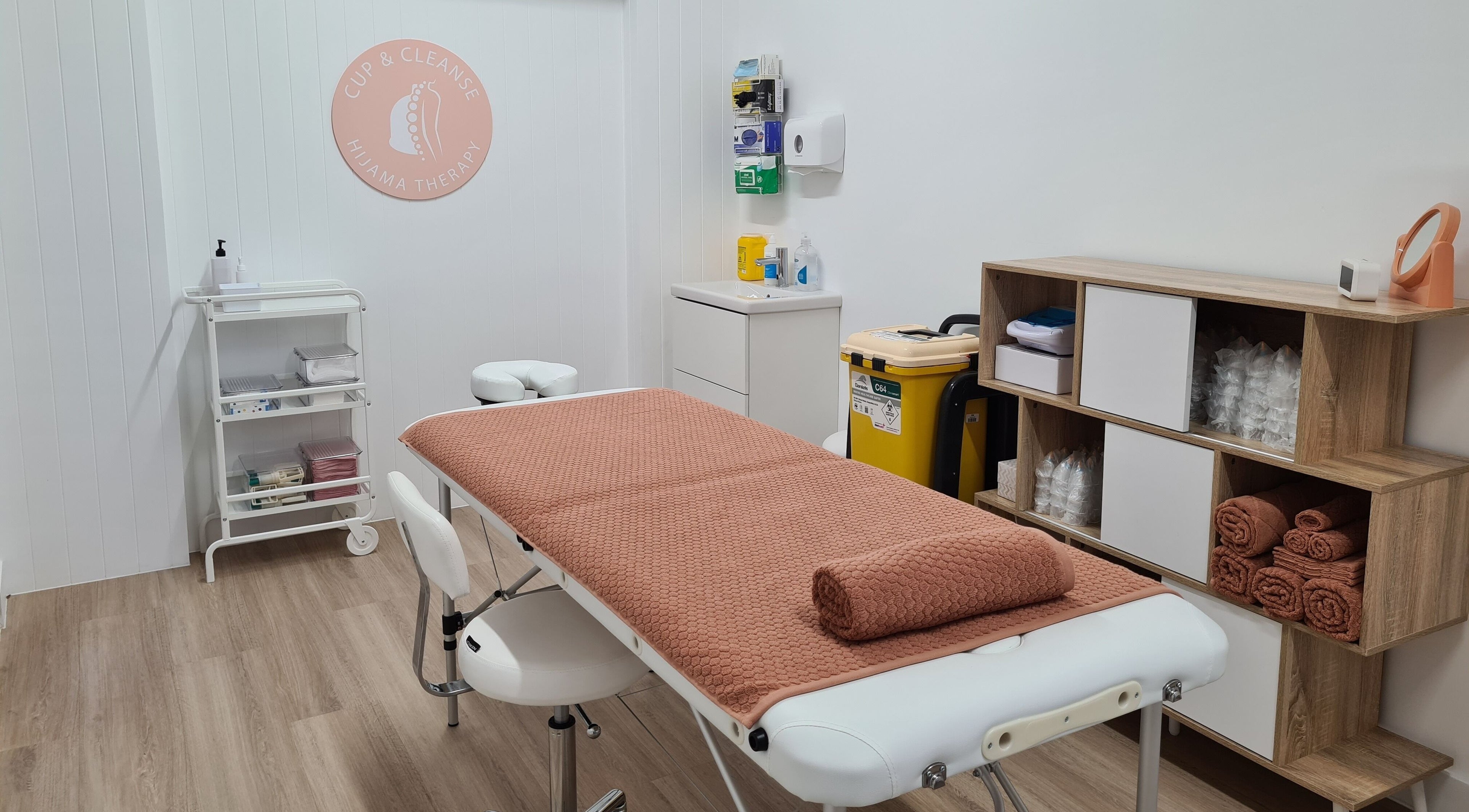 Serene treatment room at Cup & Cleanse, Runaway Bay, Queensland, AU with massage table and equipment.